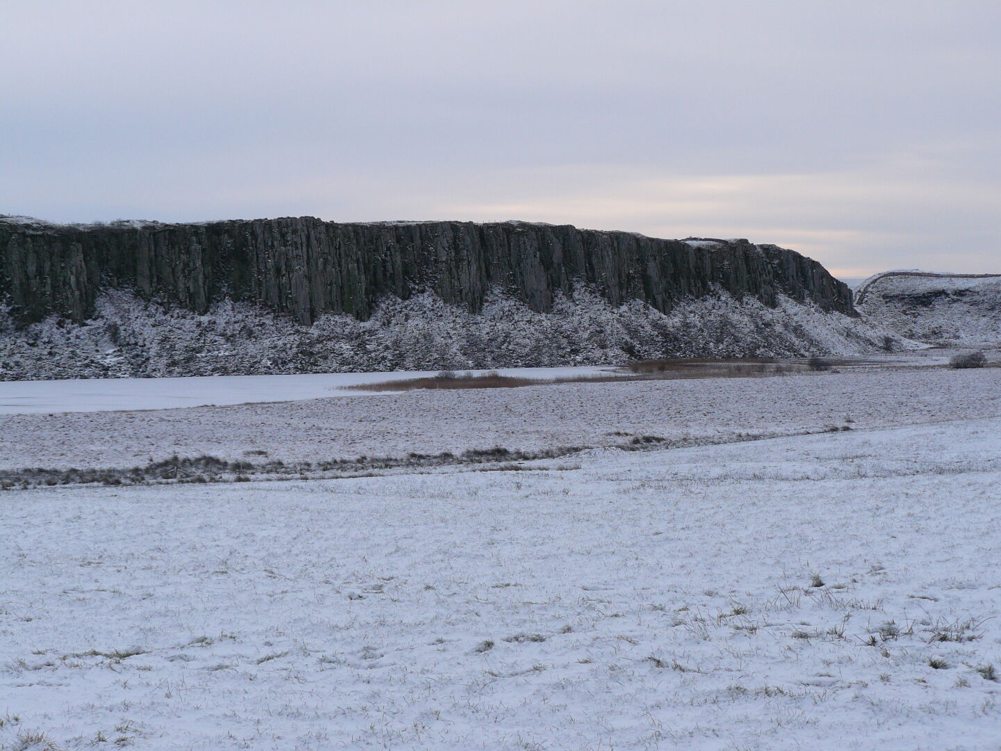 The crags (cliffs) from the other side. The wall runs on top of them.