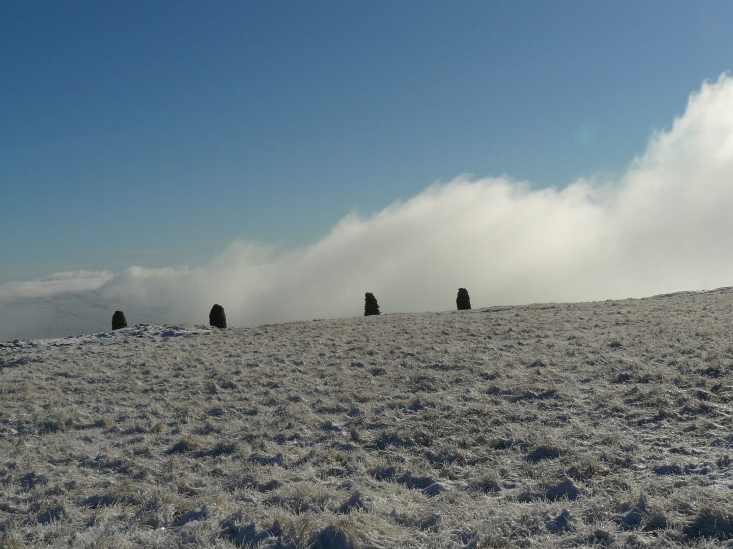 The top has a collection of cairns on it.