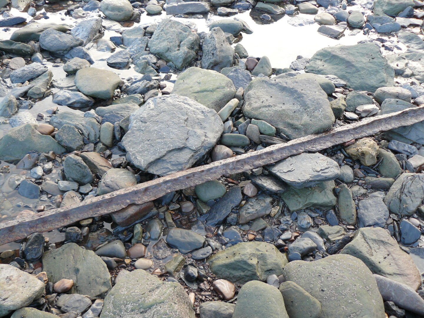and that the beach is littered with scrap metal