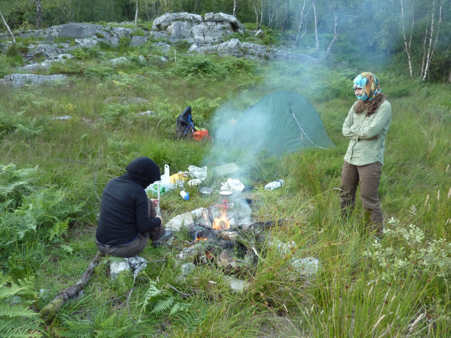 Campsite near Kinlochleven. The fire is supposed to keep the midges away, but I guess they do not know about this. Right photo (c) James Mellors